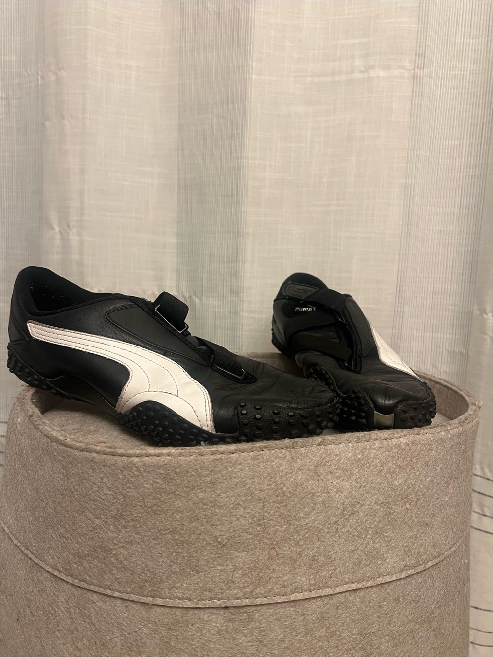 PUMA Mostro Sneakers in black & white color-way with Velcro straps & spiked sole
